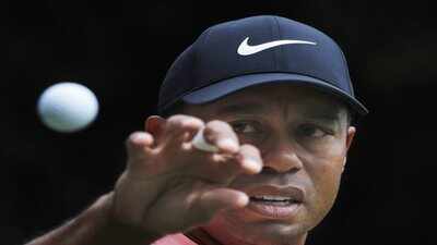 mexico city tiger woods eyes a ball to catch that was tossed at him by his cadd